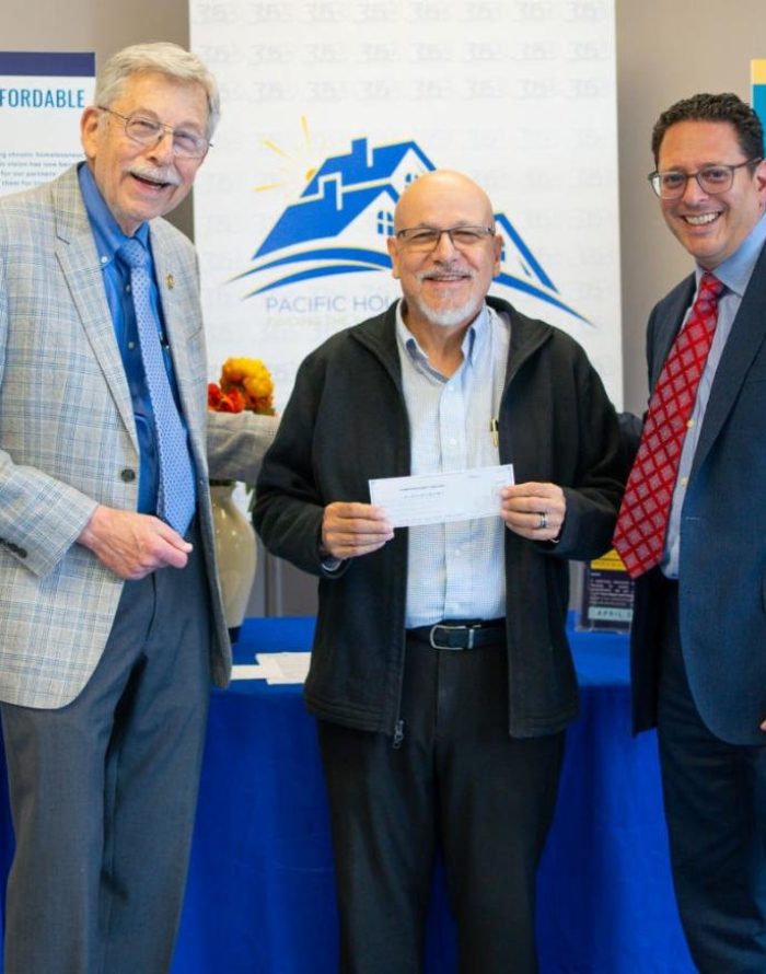 Allan Lang of the Stamford Rotary Trust Fund; Rafael Pagan Jr., Executive Director of Pacific House; Chris Farrugio of the Stamford Rotary Trust Fund.