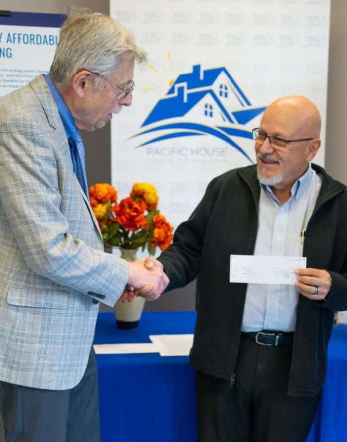 Allan Lang of the Stamford Rotary Trust Fund and Rafael Pagan Jr., Executive Director of Pacific House.